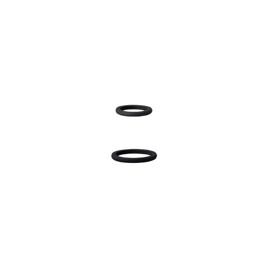 Two black rubber washers on a white background
